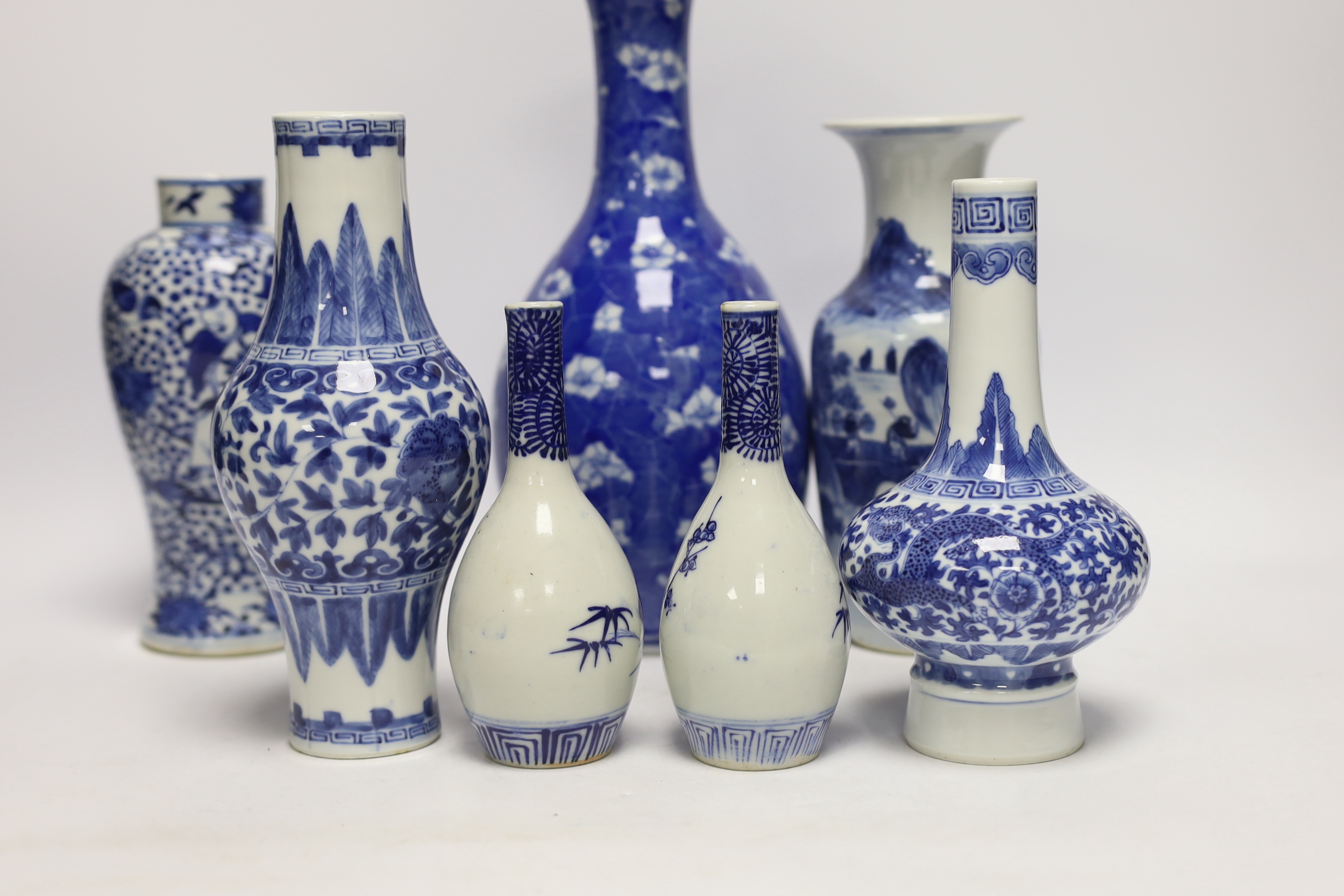 Seven Chinese or Japanese blue and white vases, late 19th/early 20th century, largest 27cm high